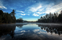 Fine art by Ruth A. B. Clegg of a clear pond reflecting calm light, composed to support visual clarity and presence.