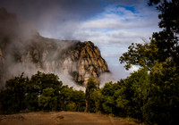 Fine art by Ruth A. B. Clegg capturing Montserrat’s mountainous presence, emphasizing scale and calm depth.